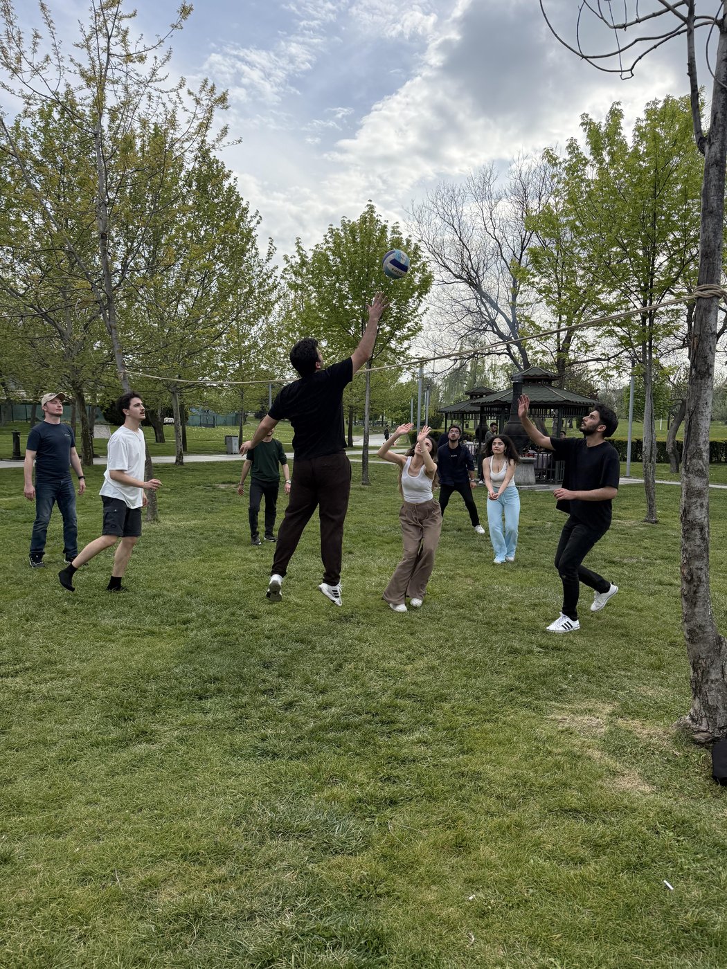 Students experience enjoyable moments in the event area while competing in a volleyball match.