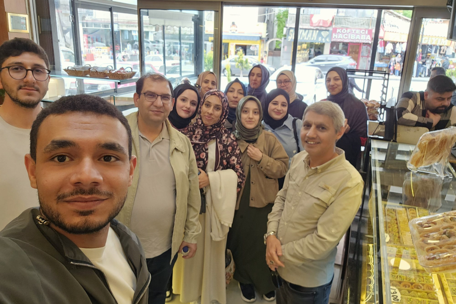 Our professors and students posing for a group photo at the restaurant.