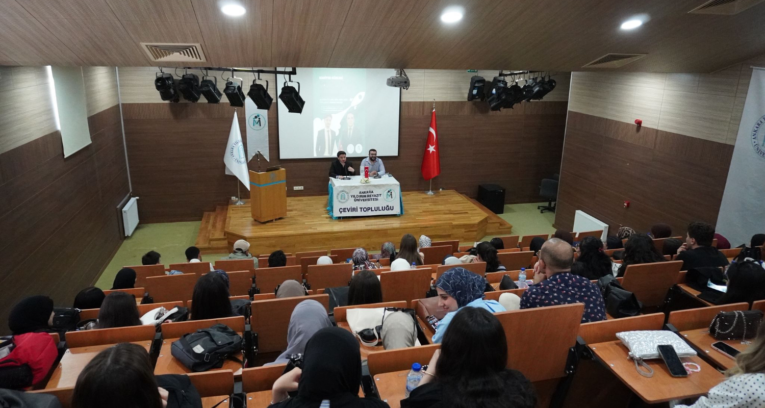 Group photo taken in the conference hall.