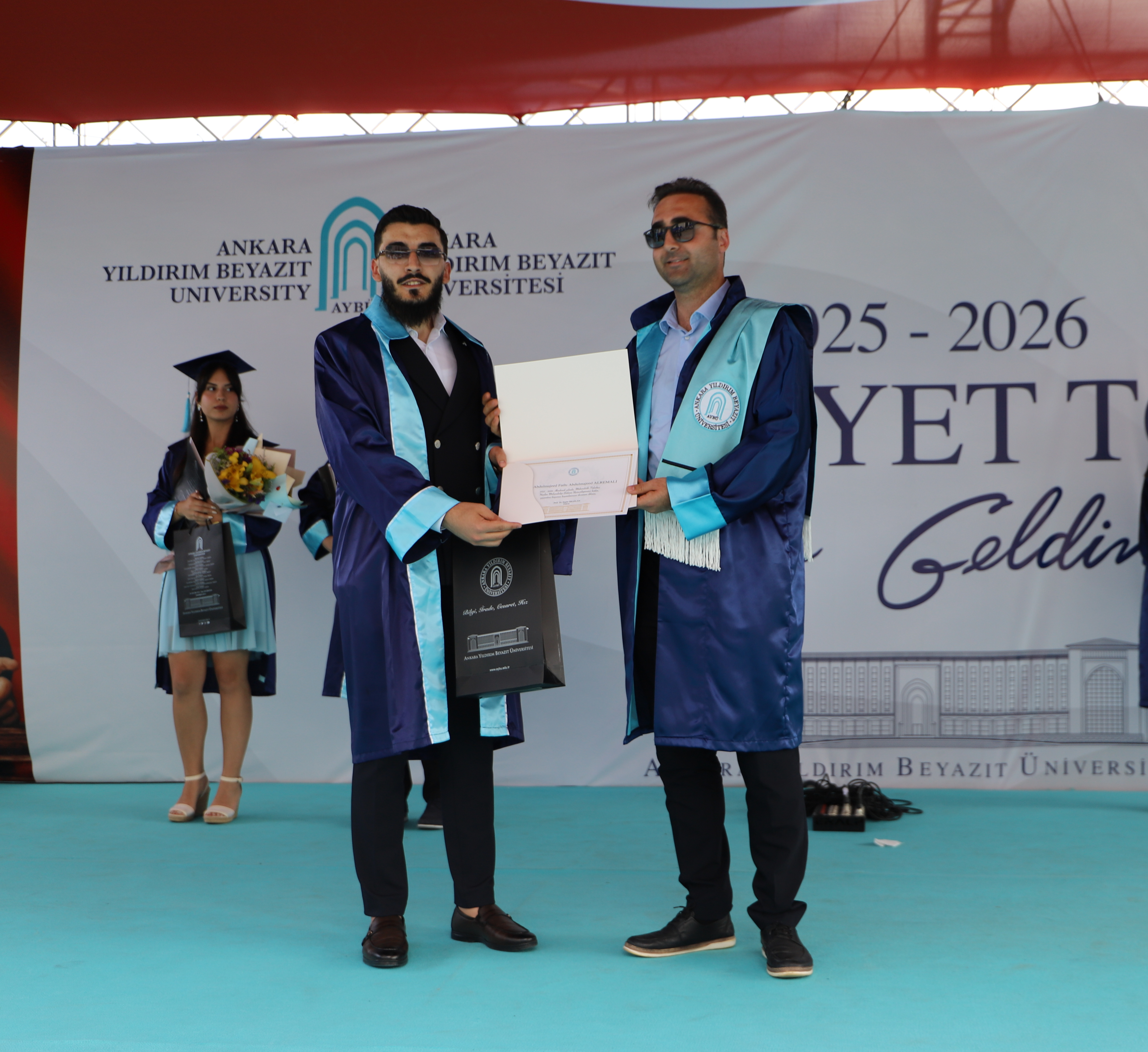 Our Vice Chair, Asst. Prof. Dr. Mehmet Ulvi Şimşek, presents the diploma and commemorative gift to our department's third-ranked graduate, Abdulmajeed Fathi Abdulmajeed Alremali.